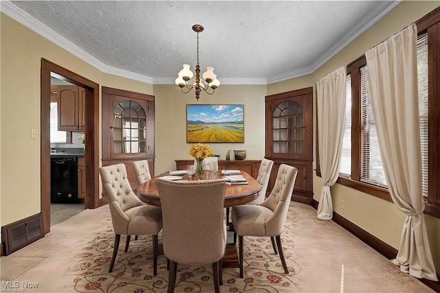 dining room featuring light carpet, visible vents, plenty of natural light, and a chandelier