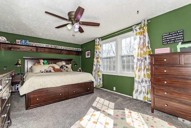 bedroom featuring carpet flooring, a ceiling fan, baseboards, and a textured ceiling