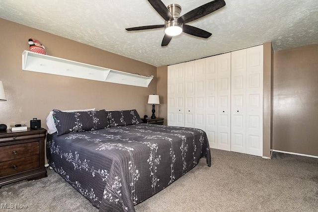 carpeted bedroom featuring a closet, a textured ceiling, and a ceiling fan