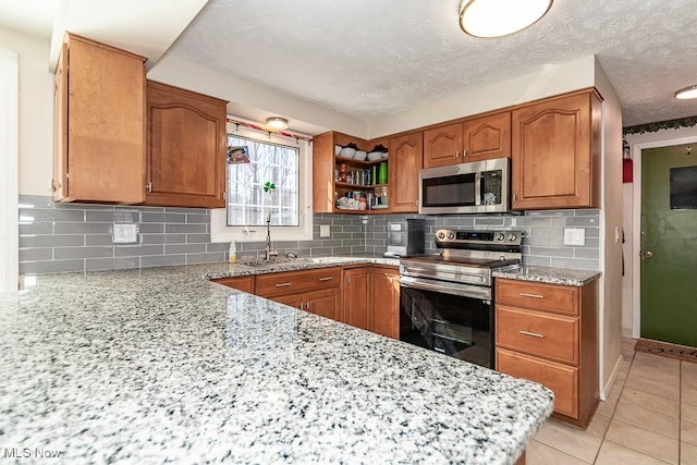 kitchen featuring a sink, brown cabinets, and appliances with stainless steel finishes