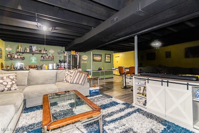 living room featuring indoor wet bar and wood finished floors