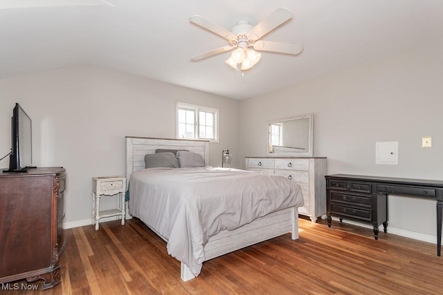 bedroom featuring a ceiling fan, wood finished floors, and baseboards