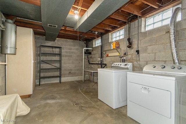 below grade area with washer and dryer and visible vents