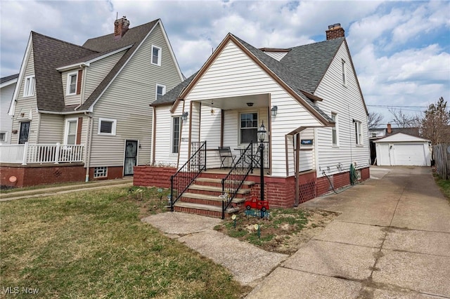 bungalow-style home featuring a front lawn, a porch, an outdoor structure, and a chimney