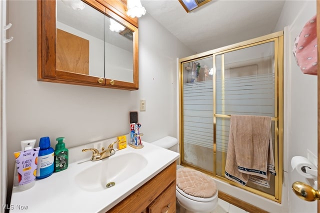 full bathroom with an enclosed shower, toilet, and vanity