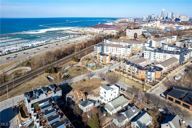 drone / aerial view featuring a view of city and a water view