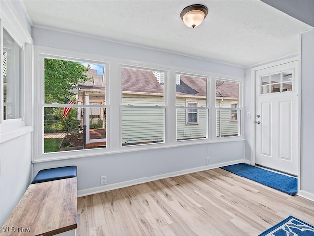 unfurnished sunroom with a healthy amount of sunlight