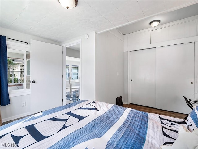 bedroom featuring a closet and wood finished floors