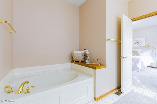 bathroom with a bath, visible vents, and tile patterned floors