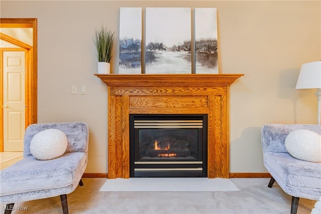 living area with carpet flooring, baseboards, and a fireplace with flush hearth