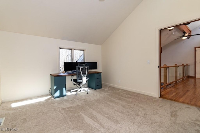 home office with baseboards, a ceiling fan, carpet, and lofted ceiling