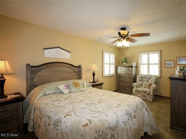 bedroom with carpet floors, a textured ceiling, and a ceiling fan