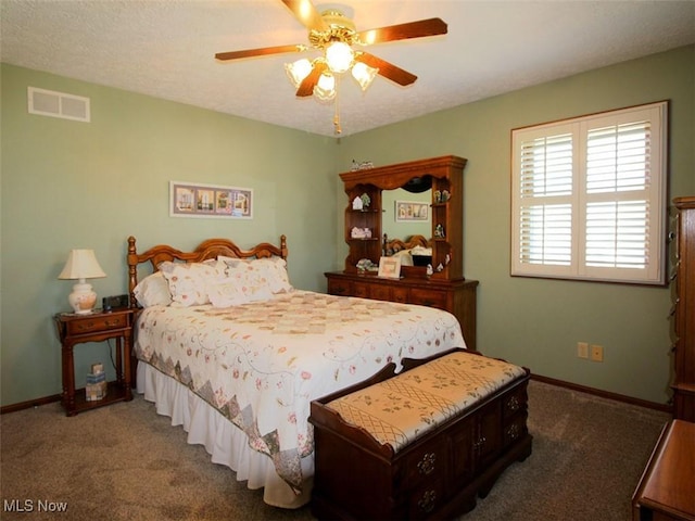 bedroom with visible vents, baseboards, a ceiling fan, and carpet flooring