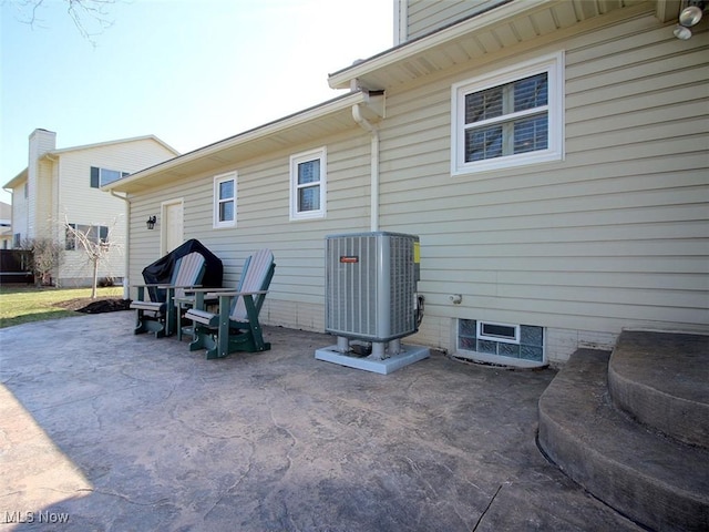 back of property featuring a patio and central AC unit