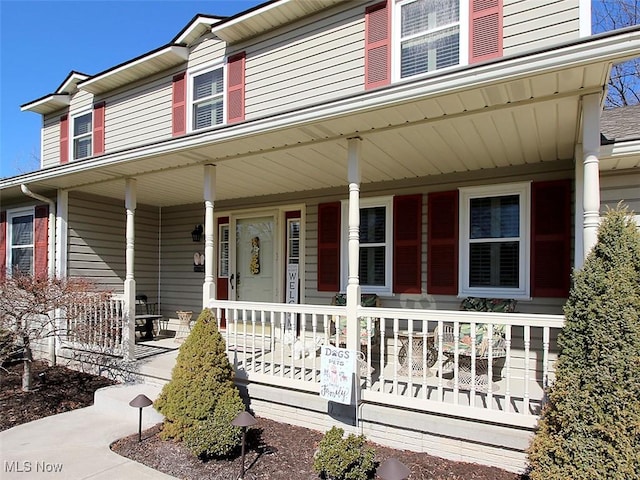 view of property featuring a porch