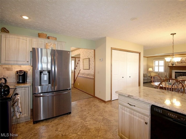 kitchen featuring dishwasher, electric range oven, stainless steel refrigerator with ice dispenser, hanging light fixtures, and a textured ceiling