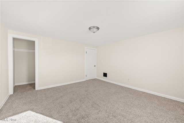 unfurnished bedroom featuring baseboards and carpet flooring