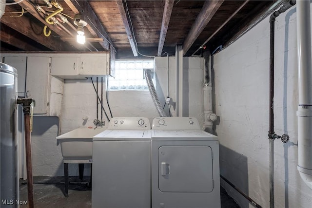 laundry area featuring laundry area, washing machine and dryer, and a sink