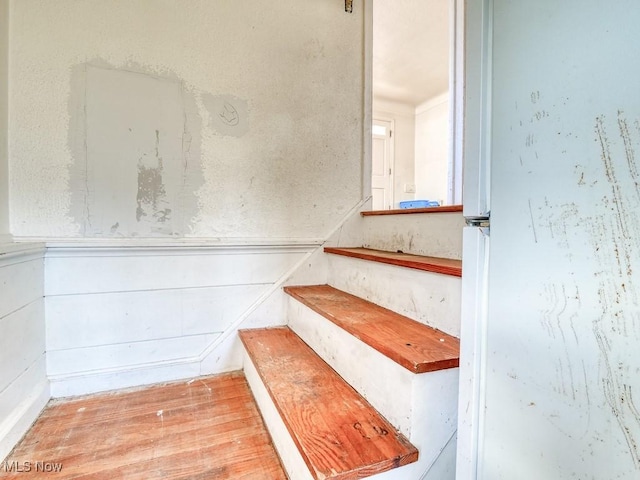 stairs with wood finished floors