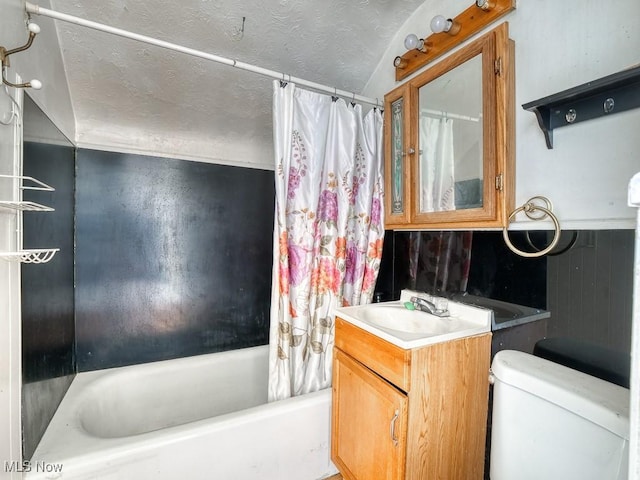 bathroom with vanity, a textured ceiling, shower / tub combo, and toilet