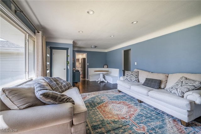 living area with recessed lighting and wood finished floors