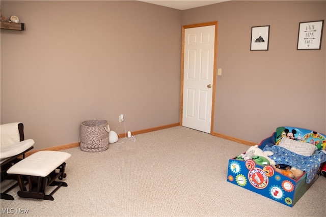 carpeted bedroom featuring baseboards