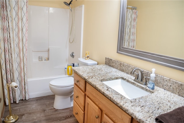 bathroom with shower / bathtub combination with curtain, toilet, wood finished floors, and vanity