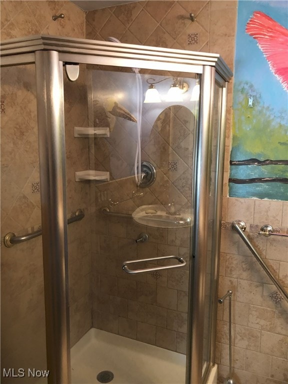 full bathroom with a stall shower