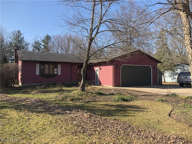 single story home featuring an attached garage and driveway