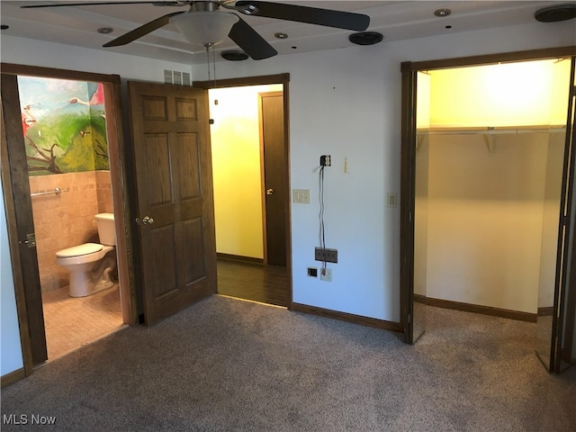 unfurnished bedroom with visible vents, baseboards, carpet, and connected bathroom