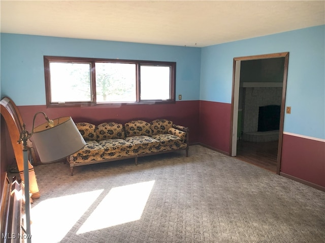 carpeted living room with a healthy amount of sunlight