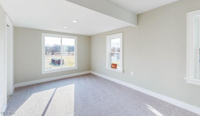 carpeted spare room featuring recessed lighting and baseboards