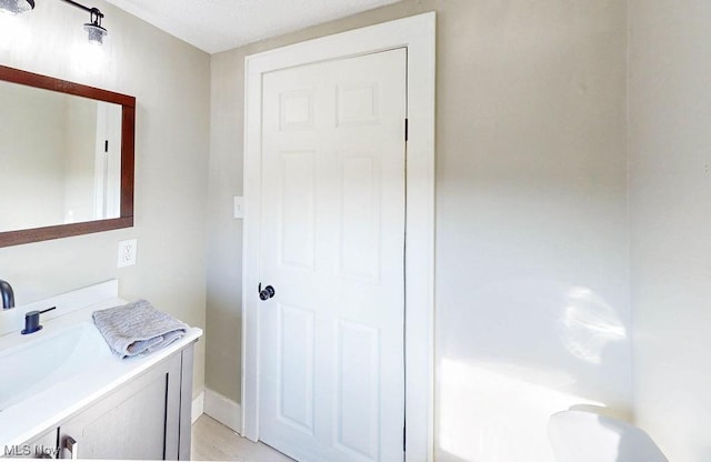 clothes washing area featuring a sink