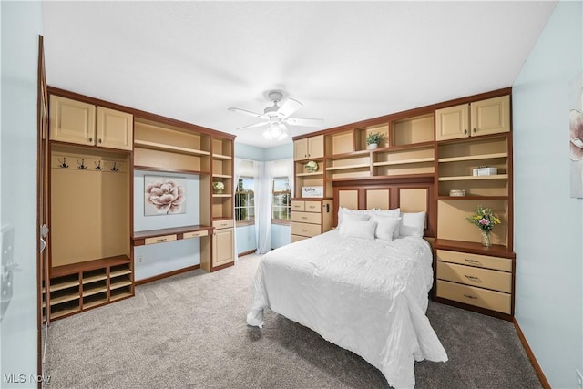 bedroom featuring light colored carpet, baseboards, and ceiling fan