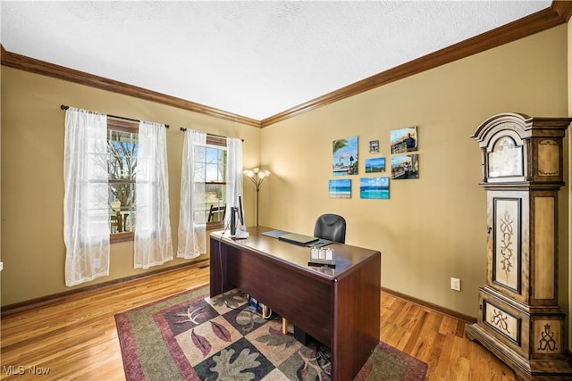 office with a textured ceiling, light wood-style floors, baseboards, and ornamental molding