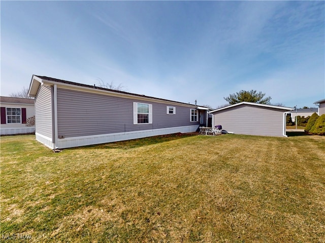 rear view of house featuring a lawn