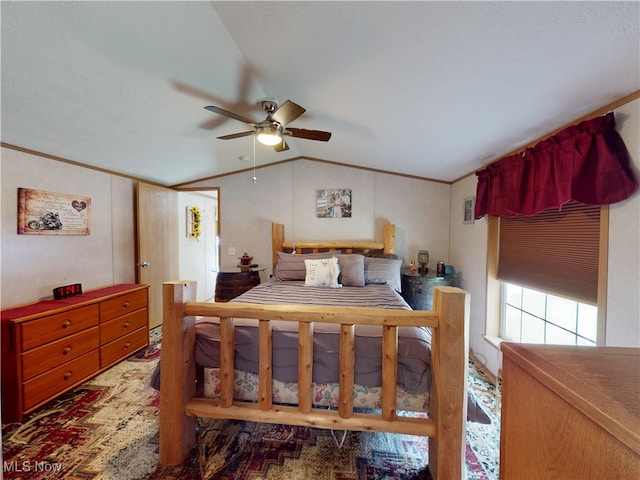 bedroom featuring lofted ceiling, crown molding, and ceiling fan