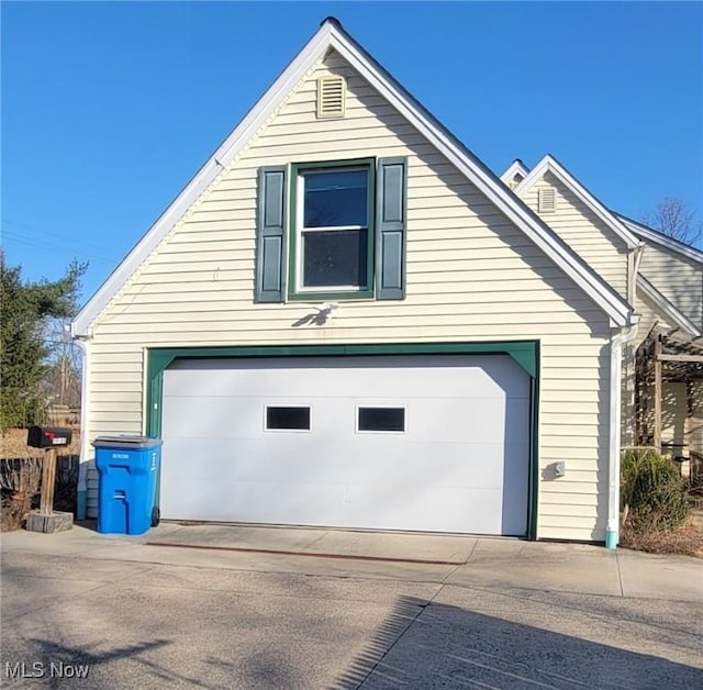 view of side of home with a garage