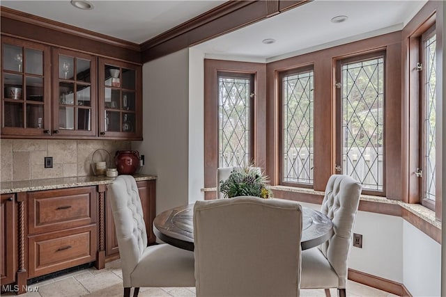 dining room with crown molding