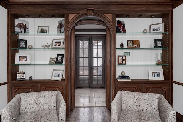 interior space with french doors and wood finished floors