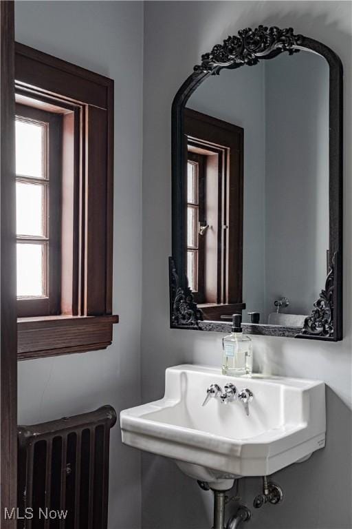 bathroom featuring a sink and radiator