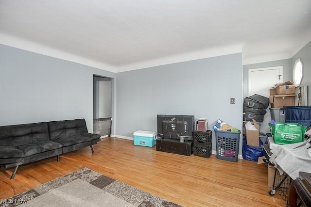 living room with wood finished floors and baseboards