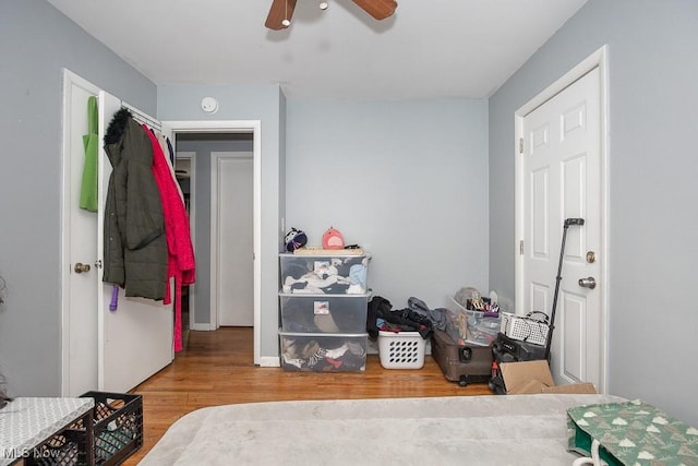 bedroom featuring ceiling fan and wood finished floors