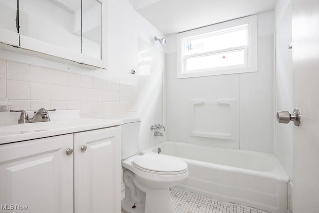 bathroom featuring toilet, decorative backsplash, tile patterned flooring, shower / bath combination, and vanity