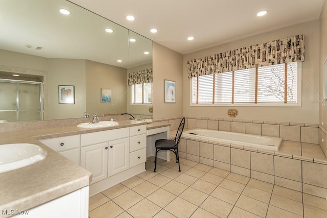 bathroom with tile patterned floors, a shower stall, recessed lighting, and vanity