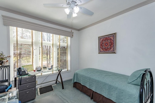 carpeted bedroom with baseboards, a ceiling fan, and crown molding