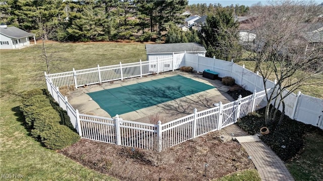 view of pool with a fenced backyard, a fenced in pool, and a yard