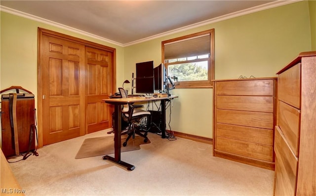 carpeted office space featuring baseboards and crown molding