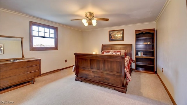 carpeted bedroom featuring a ceiling fan, crown molding, and baseboards