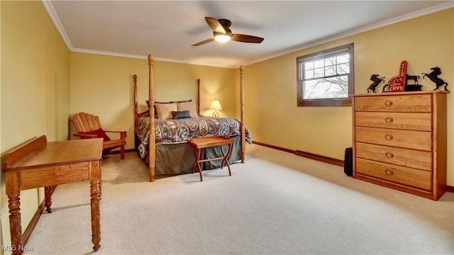 carpeted bedroom featuring ceiling fan, crown molding, and baseboards